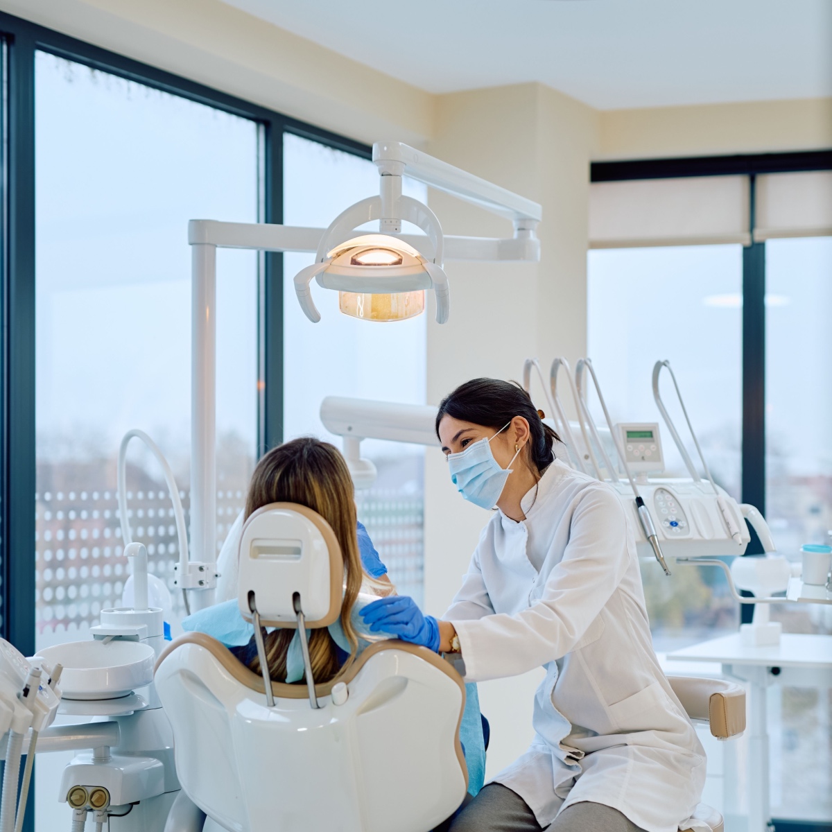 A dentist educating their patient using OrthoPhoto